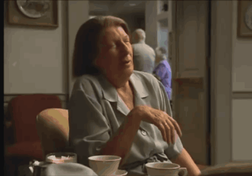 Livia Dismissive Wave animated GIF
