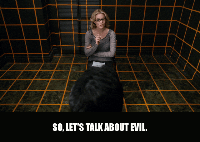 Gillian Jacobs in Community (2009), captioned "So, let's talk about evil.", Intense and Menacing reaction animated GIF