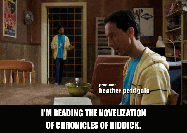 Danny Pudi in Community (2009), captioned "I'm reading the novelization of Chronicles of Riddick.", Deadpan and Defensive reaction animated GIF