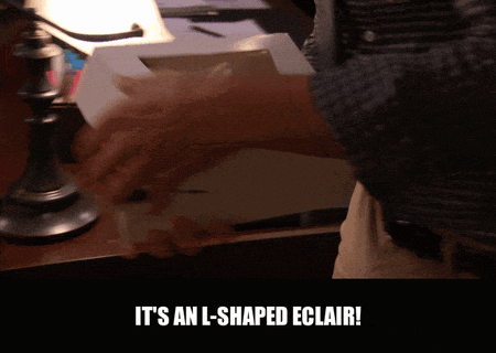 Adam Scott in Parks and Recreation (2009), captioned "It's an L-shaped eclair!", Excited and Proud reaction animated GIF