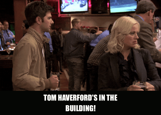 Aziz Ansari in Parks and Recreation (2009), captioned "Tom Haverford's in the building!", Confident and Excited reaction animated GIF