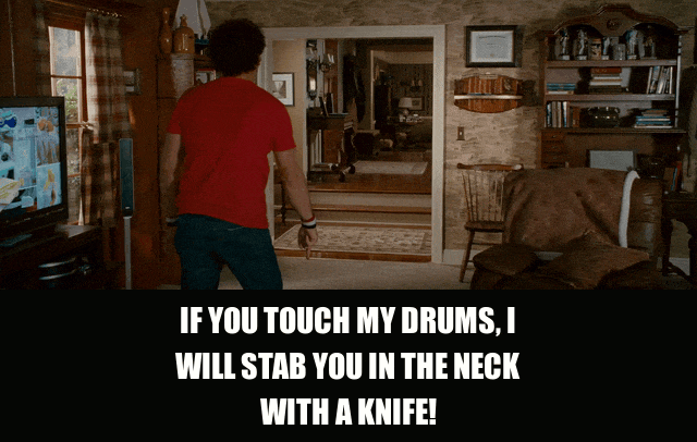 John C. Reilly in Step Brothers (2008), captioned "If you touch my drums, I will stab you in the neck with a knife!", Furious and Threatening reaction animated GIF