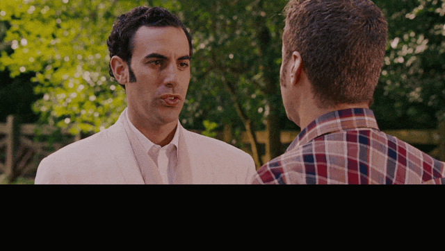 Sacha Baron Cohen and Will Ferrell in Talladega Nights: The Ballad of Ricky Bobby (2006), captioned "Do you know why I came to America, Ricky Bobby? Public schools, healthcare system, giant water parks. I mean, the same reason anyone comes to America.", Deadpan and Earnest reaction animated GIF