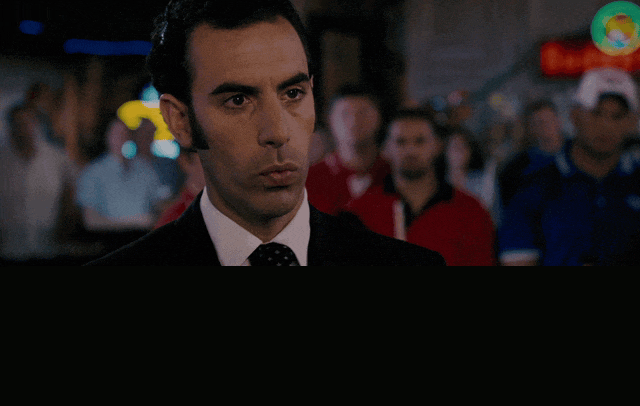 Sacha Baron Cohen in Talladega Nights: The Ballad of Ricky Bobby (2006), captioned "We invented democracy, existentialism, and the blowjob.", Smug and Condescending reaction animated GIF