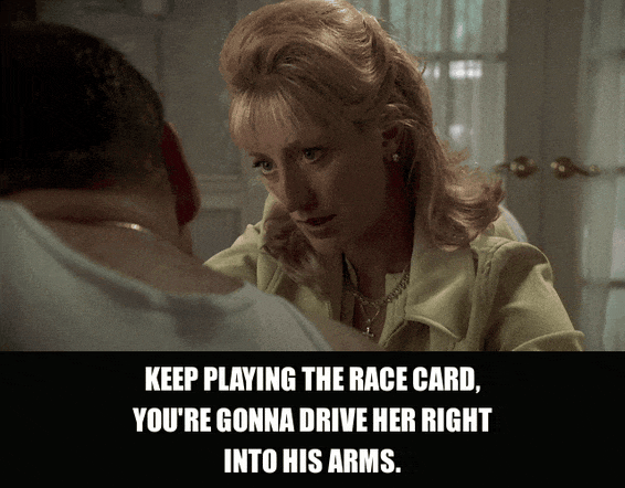 Edie Falco in The Sopranos (1999), captioned "Keep playing the race card, you're gonna drive her right into his arms.", Warning and Exasperated reaction animated GIF