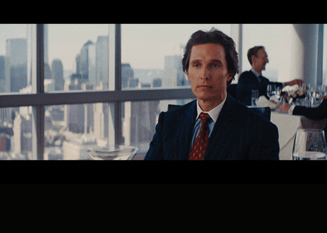 Matthew Mcconaughey in The Wolf of Wall Street (2013), captioned "Cocaine and hookers, my friend.", Smug and Matter-Of-Fact reaction animated GIF