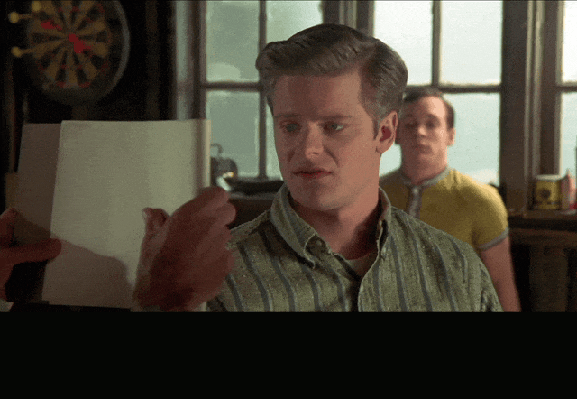 The Oneders? from That Thing You Do! (1996), captioned "Yeah, it looks like The 'O-need-ers.'", Skeptical and Amused reaction animated GIF